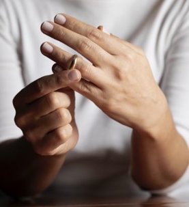 person taking wedding ring off