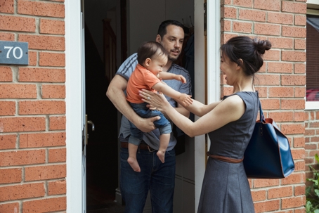 Mother picking up her child